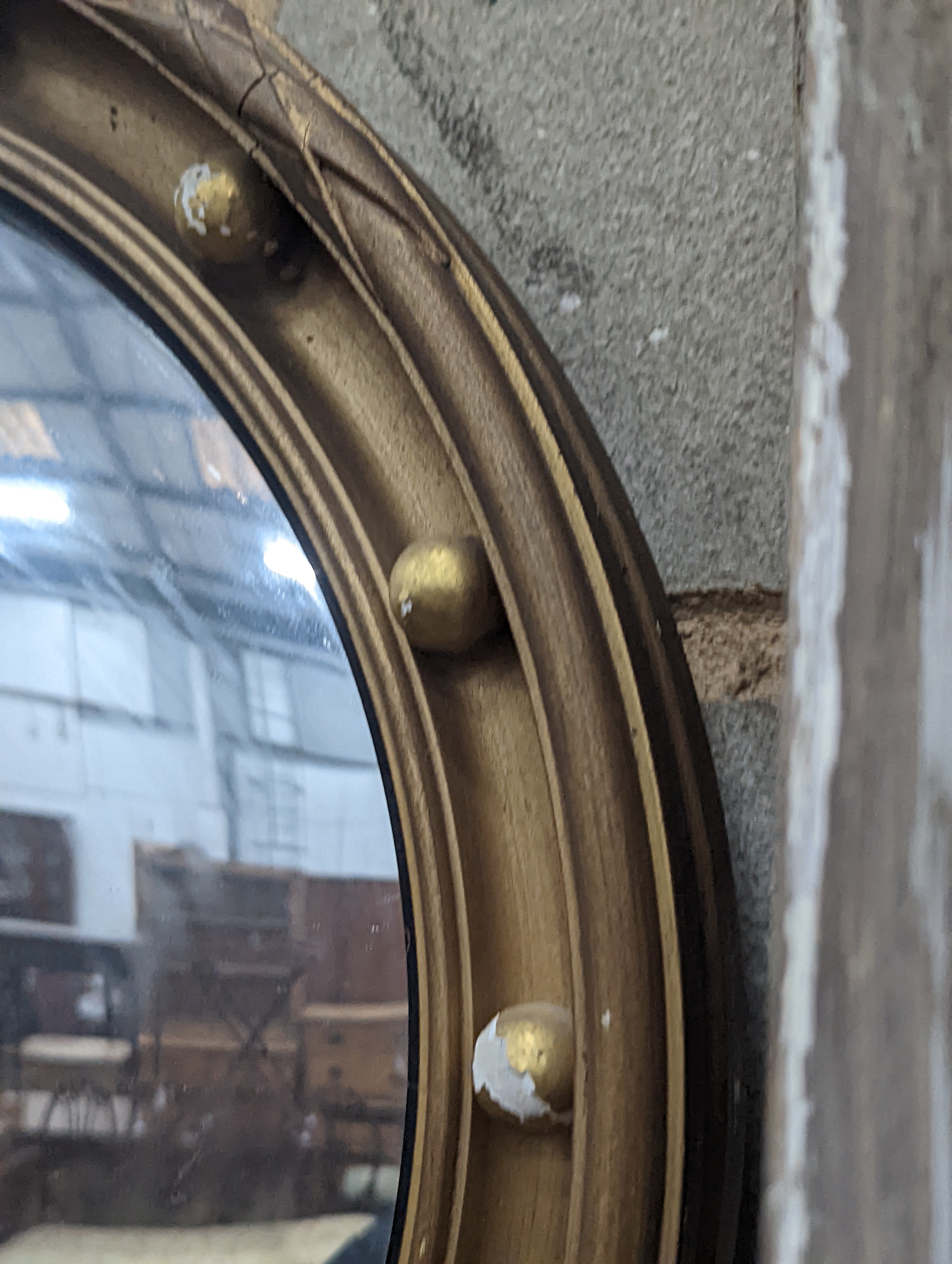 A Regency style circular gilt framed convex wall mirror, diameter 45cm